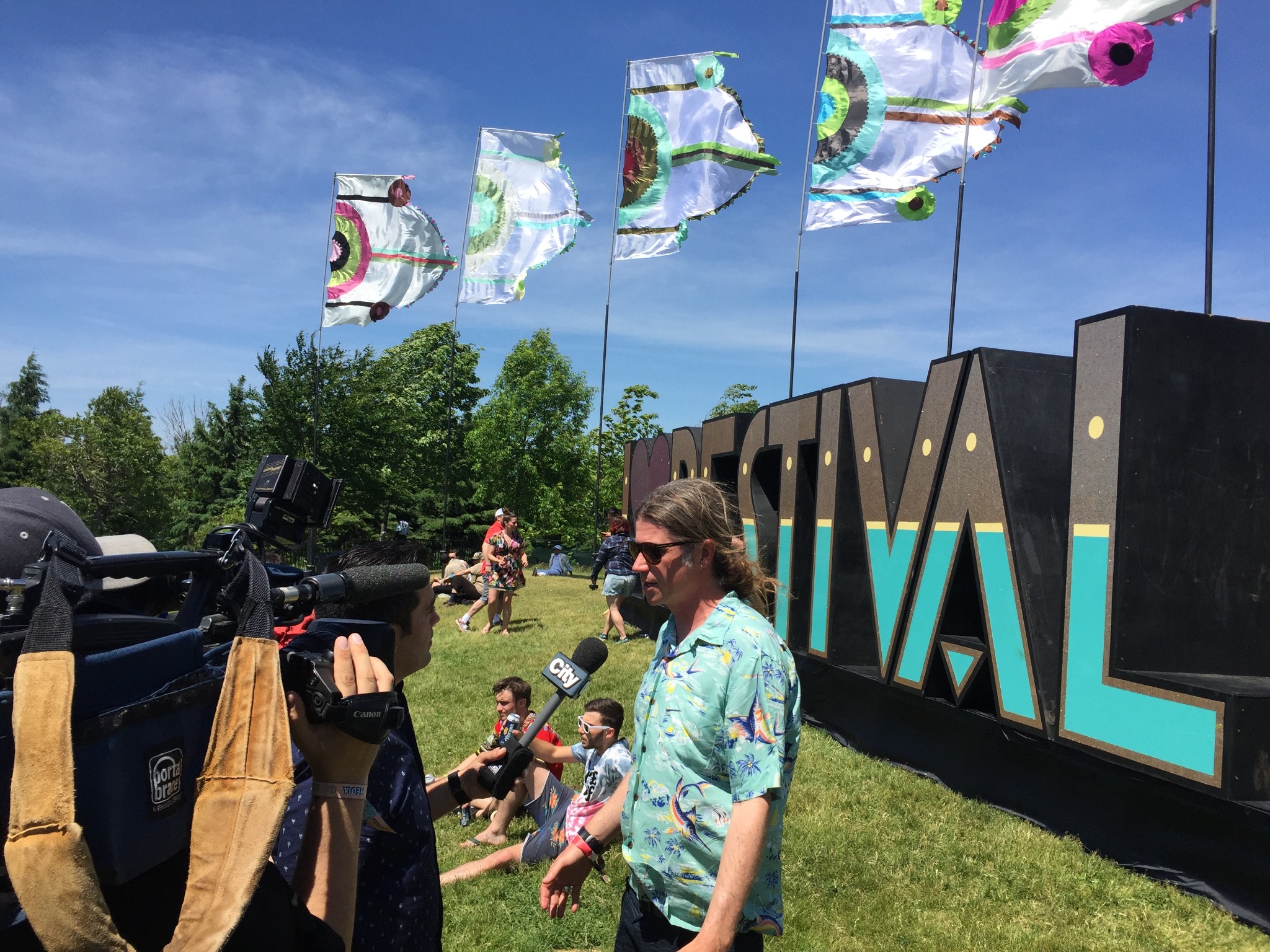 A television interview taking place at a music festival